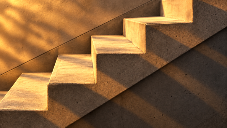 Concrete detail, after “Warm golden hour light casting long dramatic shadows”